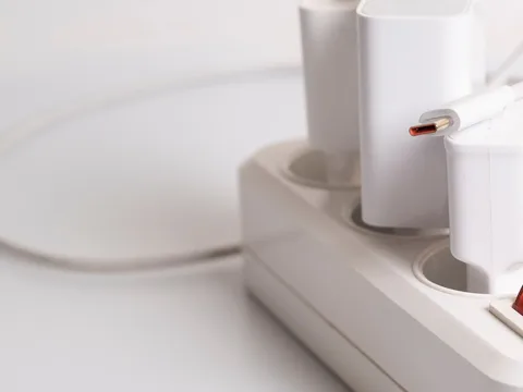 Several charging plugs arranged at an electrical outlet.
