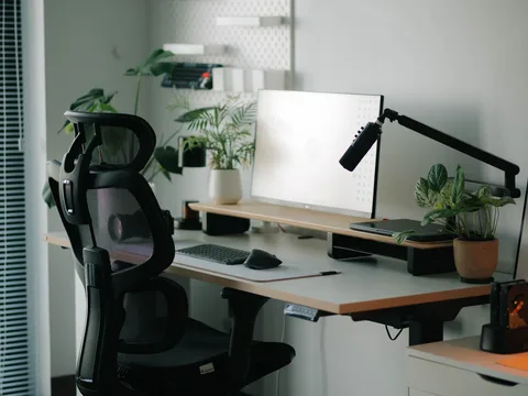 An office chair positioned at a home desk.